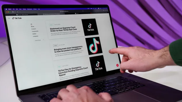 Close-up of a person interacting with TikTok content on a laptop indoors. A brand safety score rarely measures what buyers assume it does